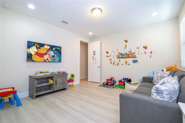 8419 Pippen Dr, Orlando, FL 32836 - recreation room with light wood-style flooring, baseboards, and recessed lighting