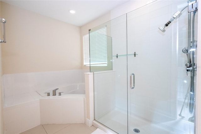 8419 Pippen Dr, Orlando, FL 32836 - full bathroom with a stall shower, a garden tub, tile patterned flooring, and recessed lighting