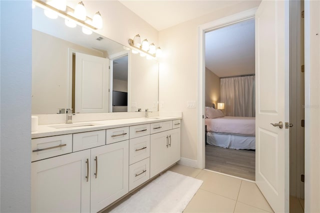 8419 Pippen Dr, Orlando, FL 32836 - ensuite bathroom featuring tile patterned floors and double vanity