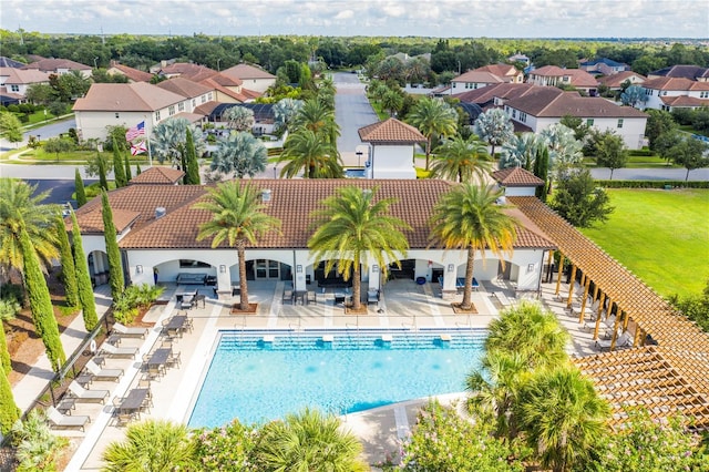 8419 Pippen Dr, Orlando, FL 32836 - community pool featuring a residential view and a patio area
