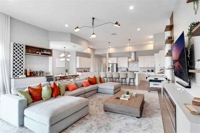 15947 Vetta Dr, Bella Collina, FL 34756 - living area featuring wine cooler, recessed lighting, and a chandelier