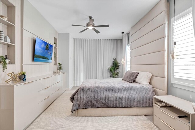 15947 Vetta Dr, Bella Collina, FL 34756 - bedroom with light carpet and a ceiling fan