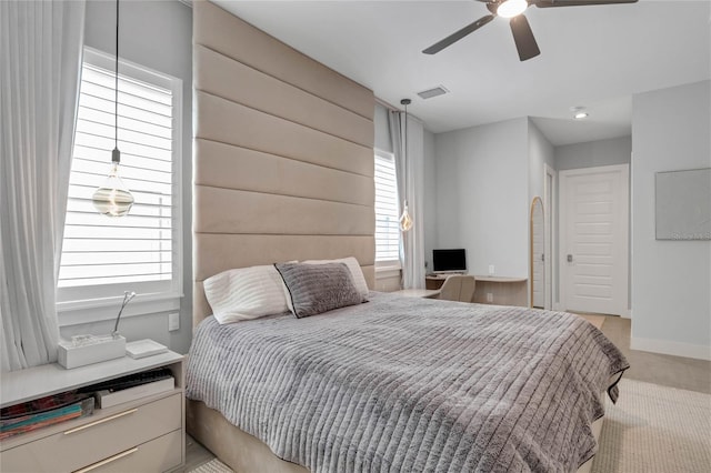 15947 Vetta Dr, Bella Collina, FL 34756 - bedroom with light carpet, a ceiling fan, and baseboards