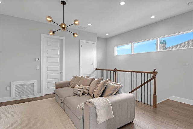 15947 Vetta Dr, Bella Collina, FL 34756 - living room with a chandelier, wood finished floors, baseboards, and recessed lighting