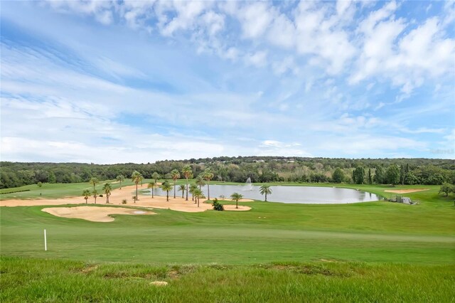 15947 Vetta Dr, Bella Collina, FL 34756 - view of home's community with a water view, a yard, golf course view, and view of wooded area