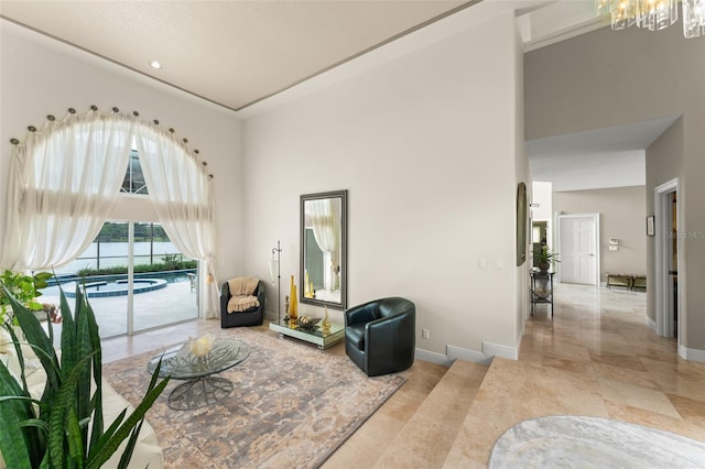 4536 N Landmark Dr, Orlando, FL 32817 - living area featuring a high ceiling, a chandelier, recessed lighting, and light tile patterned flooring