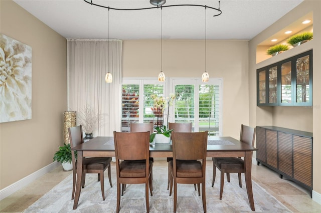 4536 N Landmark Dr, Orlando, FL 32817 - dining room featuring baseboards