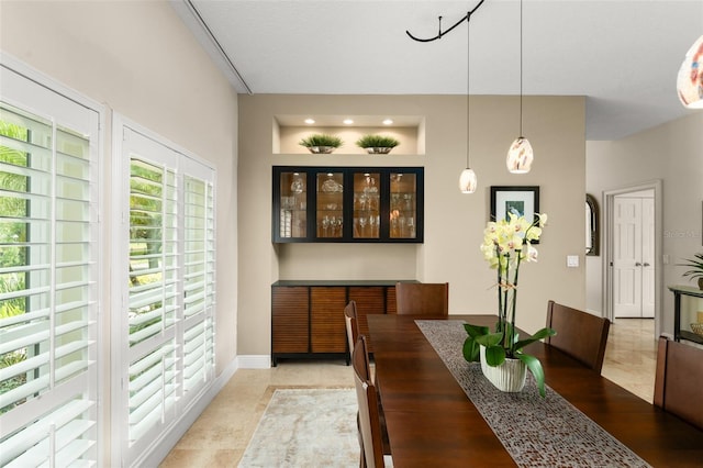 4536 N Landmark Dr, Orlando, FL 32817 - dining room featuring baseboards and light tile patterned flooring