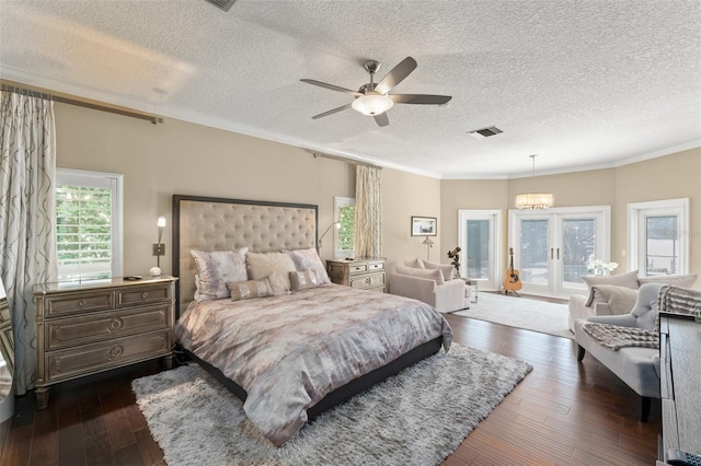 4536 N Landmark Dr, Orlando, FL 32817 - bedroom featuring access to exterior, dark wood-type flooring, crown molding, a textured ceiling, and french doors