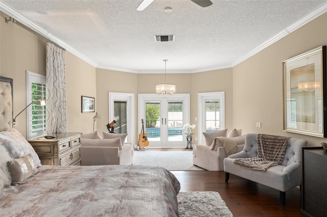 4536 N Landmark Dr, Orlando, FL 32817 - bedroom featuring access to exterior, hardwood / wood-style floors, a textured ceiling, crown molding, and french doors