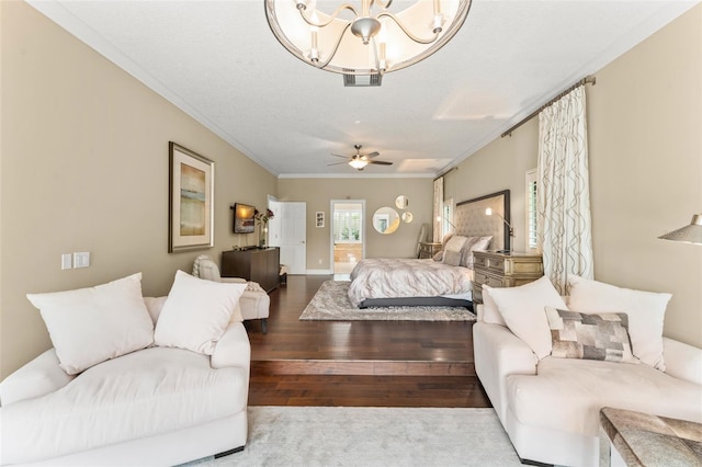 4536 N Landmark Dr, Orlando, FL 32817 - bedroom featuring hardwood / wood-style flooring, crown molding, and a chandelier