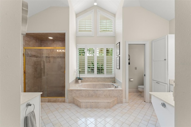 4536 N Landmark Dr, Orlando, FL 32817 - bathroom featuring a bath, a shower stall, tile patterned flooring, high vaulted ceiling, and vanity