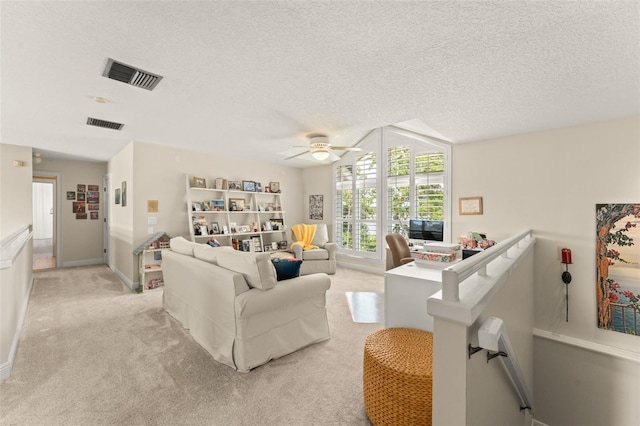 4536 N Landmark Dr, Orlando, FL 32817 - living area with a ceiling fan, light colored carpet, and a textured ceiling