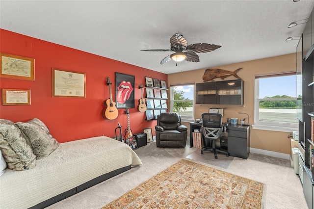 4536 N Landmark Dr, Orlando, FL 32817 - bedroom with carpet floors, a desk, and a ceiling fan