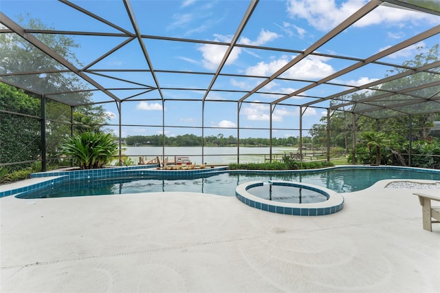 4536 N Landmark Dr, Orlando, FL 32817 - view of pool with a water view, a pool with connected hot tub, a patio area, and glass enclosure