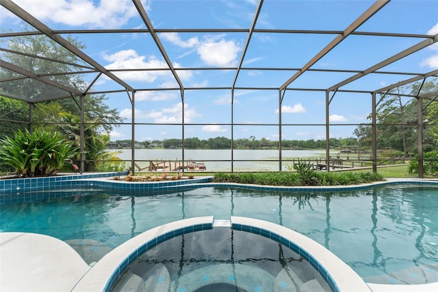 4536 N Landmark Dr, Orlando, FL 32817 - view of pool featuring a pool with connected hot tub, a water view, and a lanai