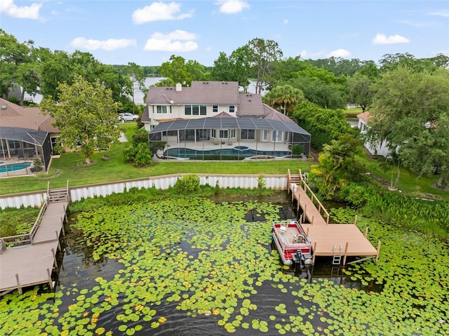 4536 N Landmark Dr, Orlando, FL 32817 - back of house with a lanai, a water view, and a yard