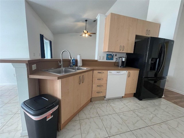 kitchen featuring black fridge, dishwasher, light brown cabinetry, a sink, and light marble finish flooring