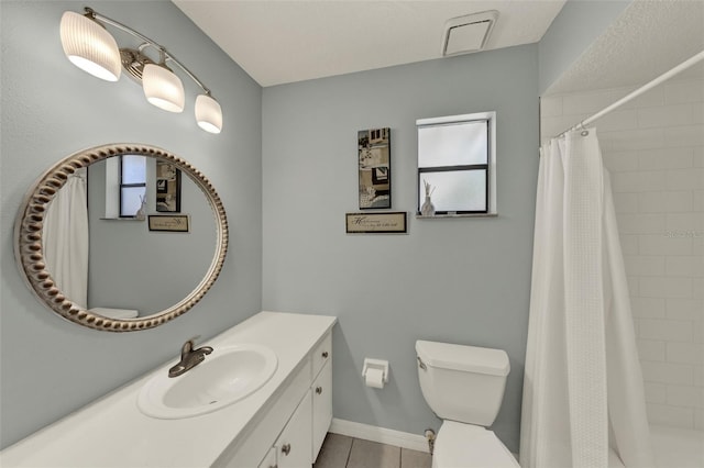 722 Ridgewood Way, Winter Springs, FL 32708 - full bathroom featuring a tile shower, tile patterned floors, toilet, vanity, and baseboards