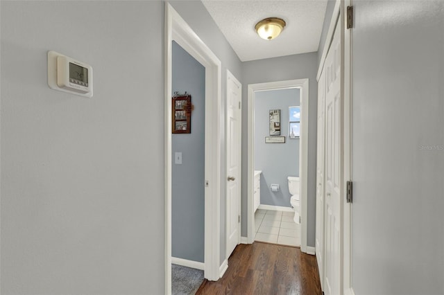 722 Ridgewood Way, Winter Springs, FL 32708 - hallway featuring baseboards and dark wood finished floors
