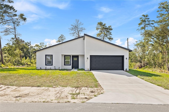 501 Marion Oaks Golf Way, Ocala, FL 34473 - view of front of house featuring a garage, driveway, a front yard, and stucco siding