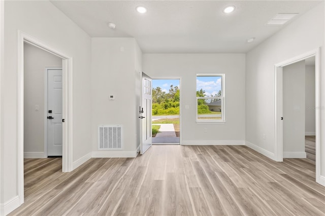 501 Marion Oaks Golf Way, Ocala, FL 34473 - unfurnished living room with light wood-style floors, baseboards, and recessed lighting