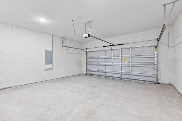501 Marion Oaks Golf Way, Ocala, FL 34473 - garage featuring electric panel, a garage door opener, and concrete block wall