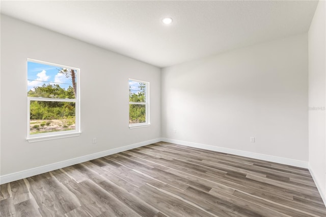 501 Marion Oaks Golf Way, Ocala, FL 34473 - empty room featuring baseboards, wood finished floors, and recessed lighting