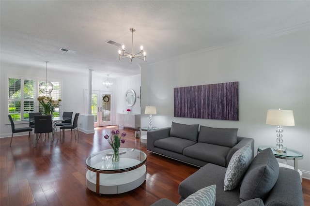 920 Cool Springs Cir, Ocoee, FL 34761 - living area featuring a chandelier, wood finished floors, baseboards, and crown molding
