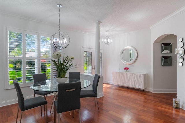 920 Cool Springs Cir, Ocoee, FL 34761 - dining space featuring ornamental molding, a chandelier, wood finished floors, baseboards, and a textured ceiling
