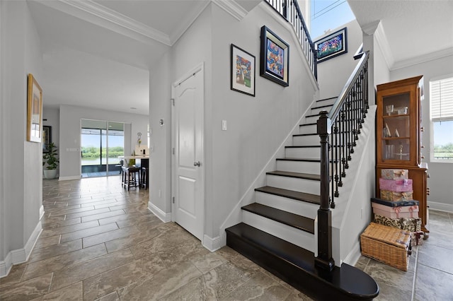 15208 Lake Claire Overlook Dr, Winter Garden, FL 34787 - staircase with baseboards and crown molding