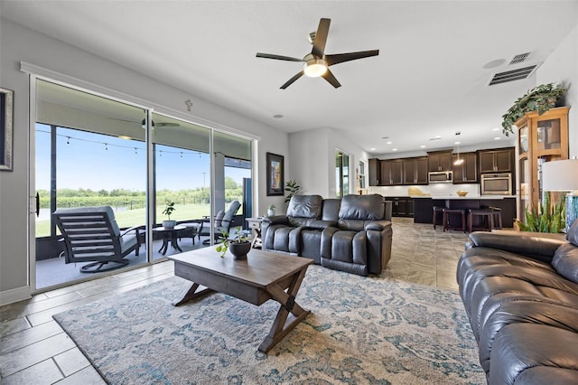 15208 Lake Claire Overlook Dr, Winter Garden, FL 34787 - living area with ceiling fan, recessed lighting, and baseboards