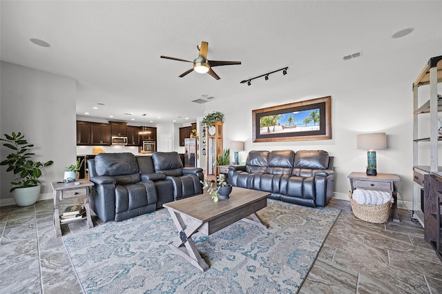 15208 Lake Claire Overlook Dr, Winter Garden, FL 34787 - living room with ceiling fan, baseboards, rail lighting, and recessed lighting