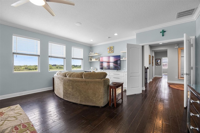 15208 Lake Claire Overlook Dr, Winter Garden, FL 34787 - living room featuring ornamental molding, baseboards, ceiling fan, dark wood-type flooring, and a textured ceiling