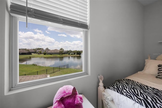 15208 Lake Claire Overlook Dr, Winter Garden, FL 34787 - bedroom featuring a water view and multiple windows