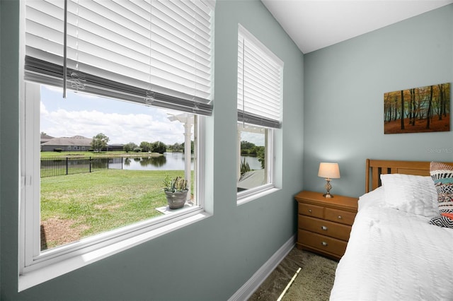 15208 Lake Claire Overlook Dr, Winter Garden, FL 34787 - bedroom with a water view and baseboards