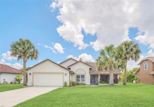 view of front of property with a front yard, a garage, and stucco siding