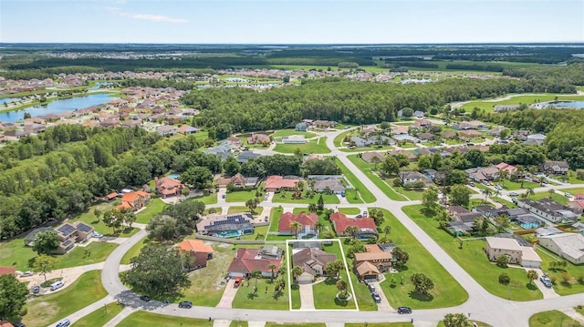 view of property location with a large body of water and nearby suburban area