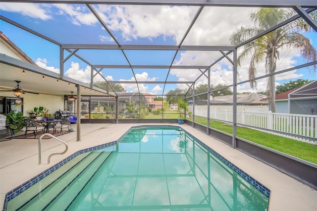 view of swimming pool with a patio and ceiling fan