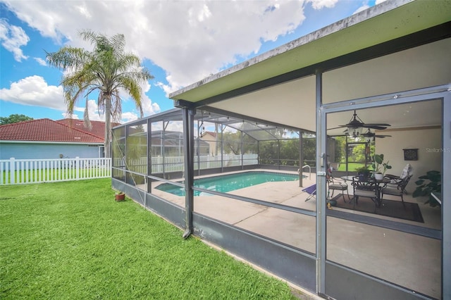 view of pool featuring a patio area, ceiling fan, and a lanai