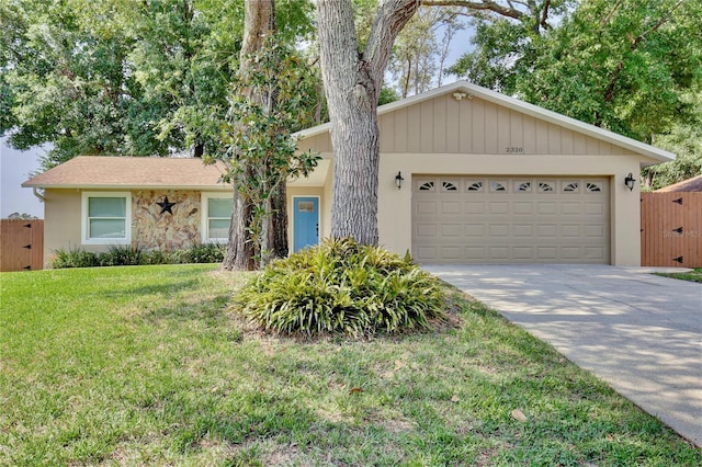 2320 Wekiva Ridge Rd, Apopka, FL 32712 - view of front of house with driveway, a front lawn, an attached garage, and stucco siding