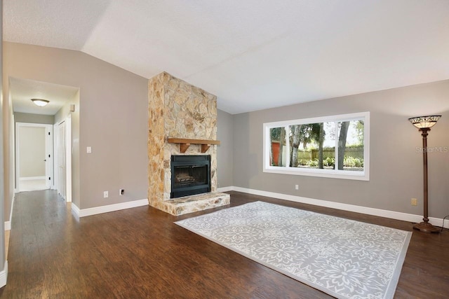 2320 Wekiva Ridge Rd, Apopka, FL 32712 - living area featuring vaulted ceiling, dark wood-type flooring, baseboards, and a fireplace