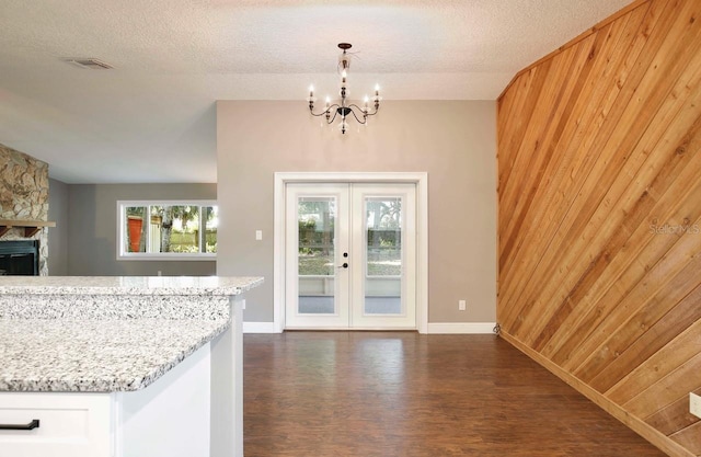 2320 Wekiva Ridge Rd, Apopka, FL 32712 - foyer entrance featuring dark wood-style flooring, a chandelier, french doors, and baseboards