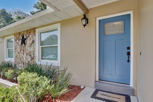 2320 Wekiva Ridge Rd, Apopka, FL 32712 - doorway to property featuring stucco siding and stone siding