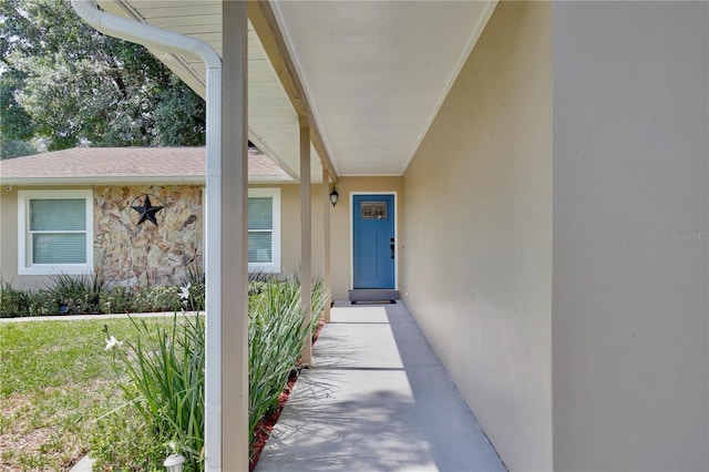2320 Wekiva Ridge Rd, Apopka, FL 32712 - doorway to property featuring stucco siding and a shingled roof