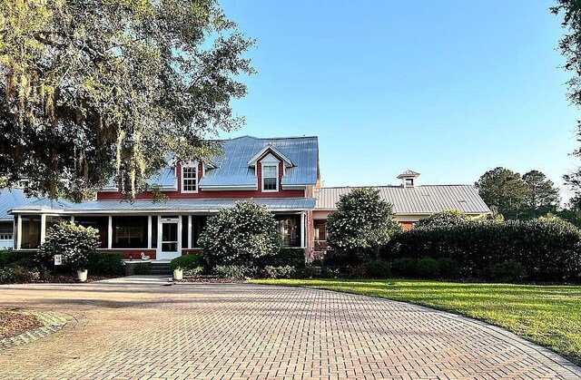 11317 NW 199th Ave, Alachua, FL 32615 - view of front of home featuring a front lawn and metal roof