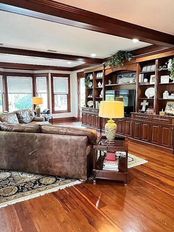 11317 NW 199th Ave, Alachua, FL 32615 - living room with beam ceiling and wood finished floors