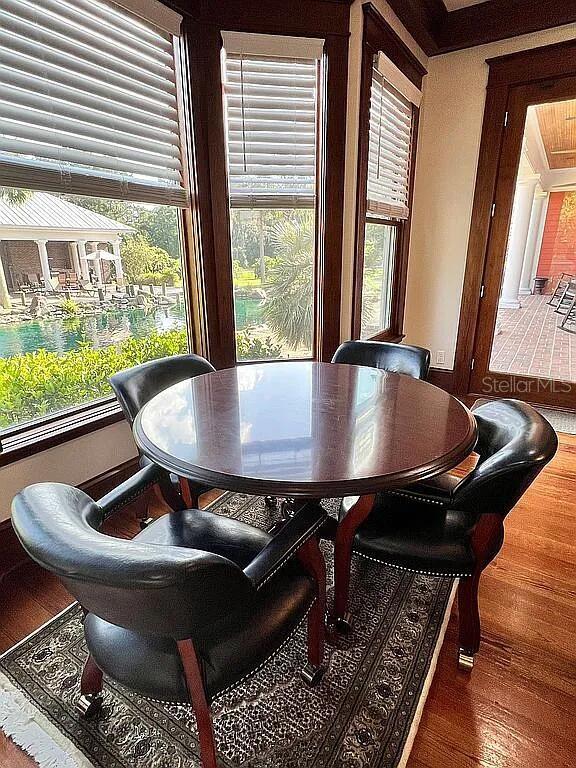 11317 NW 199th Ave, Alachua, FL 32615 - dining room featuring wood finished floors and healthy amount of natural light