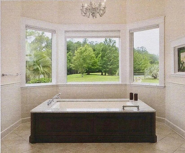 11317 NW 199th Ave, Alachua, FL 32615 - bathroom featuring healthy amount of natural light and baseboards