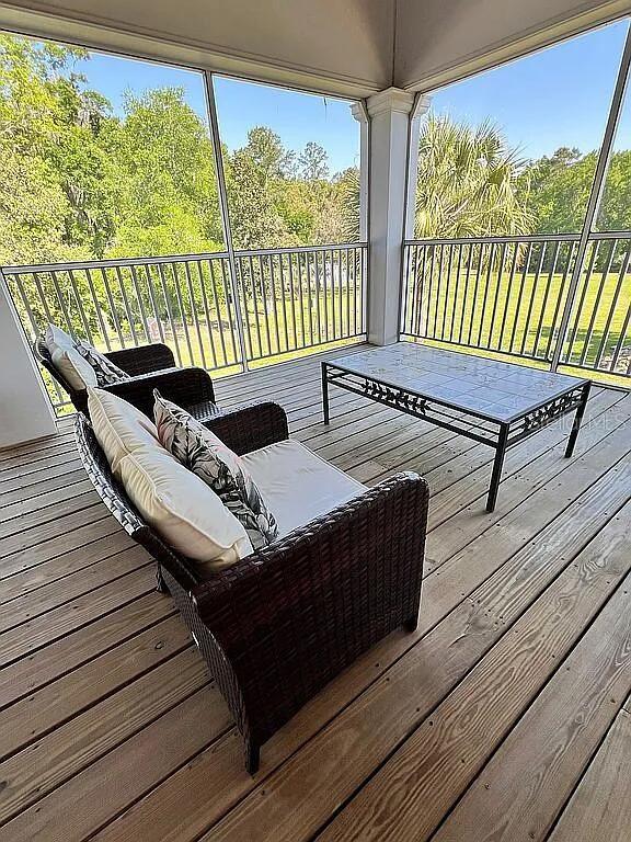 11317 NW 199th Ave, Alachua, FL 32615 - wooden terrace featuring an outdoor living space